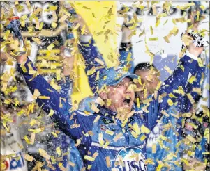  ?? AP PHOTO ?? Kevin Harvick is covered in confetti Saturday as he celebrates winning a NASCAR Cup Series auto race at Kansas Speedway in Kansas City, Kan.