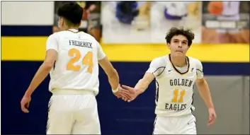  ?? MATTHEW JONAS — STAFF PHOTOGRAPH­ER ?? Frederick’s Matias Aldana, left, and Luke Justice celebrate a point against Centaurus during a class 5A boys basketball playoff game on Wednesday.