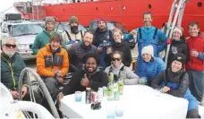  ??  ?? Job done: the assembled team in the cockpit of Pelagic Australis on their return to Port Stanley, Falkland Islands