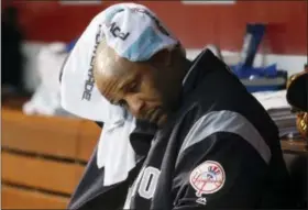  ?? JOHN MINCHILLO — THE ASSOCIATED PRESS ?? New York Yankees starting pitcher CC Sabathia wipes his head in the dugout during the fourth inning against the Cincinnati Reds. The Reds won 5-3.