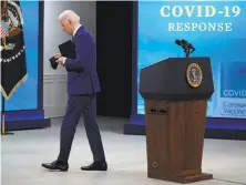  ?? Evan Vucci / Associated Press ?? President Biden leaves after warning the U.S. could slip back and urging states that lifted mask mandates to restore them.