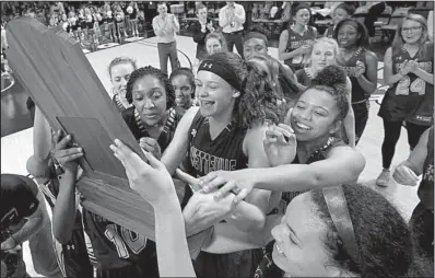  ?? Arkansas Democrat-Gazette/STEPHEN B. THORNTON ?? Fayettevil­le players celebrate with the trophy after defeating North Little Rock in the Class 7A girls championsh­ip game Saturday at Bank of the Ozarks Arena in Hot Springs. The Lady Bulldogs won the school’s seventh girls state title and thwarted the...