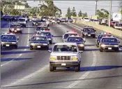  ?? LOS ANGELES TIMES/TNS 1994 ?? O.J. Simpson flees police in the back of a white Ford Bronco on the 91 Freeway in Los Angeles on June 17, 1994. The chase ended in Simpson’s arrest at his Brentwood home.