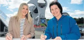  ?? PHOTO: SCOTTISH CANALS ?? Kirsten Urquhart and Catherine Topley sign the new partnershi­p at the Falkirk Wheel.