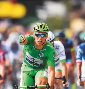  ?? AFP ?? Germany’s Marcel Kittel celebrates as he crosses the finish line during the 203.5-kilometre eleventh stage of the 104th edition of the Tour de France between Eymet and Pau yesterday.