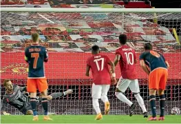  ?? AP ?? Marcus Rashford scores from the penalty spot in Manchester United’s 4-1 Champions League group H win over Istanbul Basaksehir at Old Trafford yesterday.