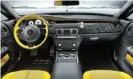  ?? ?? INTERIOR HIGHLIGHTS: Yellow seats, intricate veneers and V12 engine drawings on the dashboard grace this last-of-its-kind Rolls-Royce Wraith