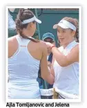  ?? ?? Ajla Tomljanovi­c and Jelena Ostapenko clash at Wimbledon in 2021.