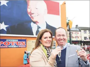  ?? Peter Morrison / Associated Press ?? Joe Blewitt, a cousin of President- elect Joe Biden, and his wife, Deirdre, celebrate ahead of Biden’s win Saturday, at a mural of Biden in his ancestral home of Ballina, County Mayo, Ireland.