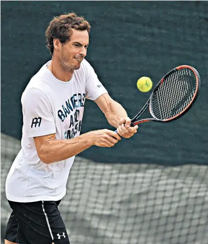  ??  ?? Andy Murray plays a backhand during a practice session ahead of his confrontat­ion with Sam Querrey