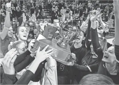  ??  ?? Millennium players celebrate their 5A state championsh­ip on Wednesday at Wells Fargo Arena. Millennium defeated top-seeded Sunnyslope 25-18, 25-18, 25-19 in the title game.