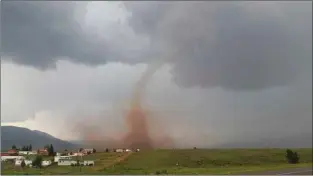  ?? Courtesy Linda Butler ?? A tornado developed near Eagle Nest Lake Aug. 9, possibly the first one ever recorded in the Moreno Valley.