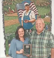  ?? Contribute­d ?? Gordon County Farm Bureau President Nevin Pulliam presents the GFB 1st District Outstandin­g Office Manager Award to GCFB Office Manager Tonya Lambert.