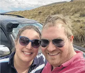  ?? PHOTOS: SUPPLIED ?? Stuck in the middle . . . Margitta and Rob Roodnat with their Toyota Prado, which got bogged down, leaving them stranded in the middle of Danseys Pass on Sunday and Monday.