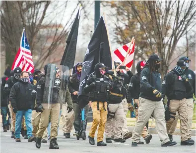  ?? JOSEPH PREZIOSO / AFP VIA GETTY IMAGES FILES ?? A militia-like group makes its way to a rally last week for U.S. President Donald Trump in Washington, D.C.