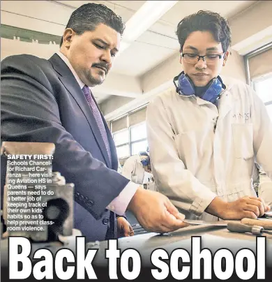  ??  ?? Schools Chancellor Richard Carranza — here visiting Aviation HS in Queens — says parents need to do a better job of keeping track of their own kids’ habits so as to help prevent classroom violence. SAFETY FIRST: