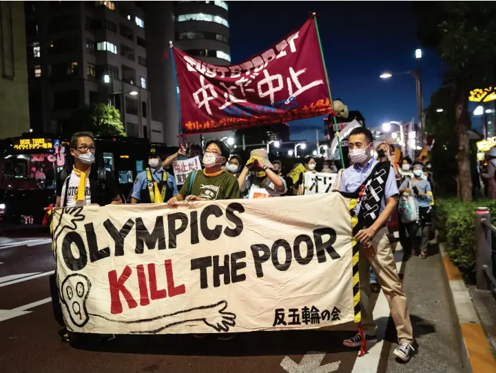  ??  ?? Protesters took to the streets in Tokyo on July 16 to demonstrat­e against holding the Summer Olympics in their country amid a coronaviru­s pandemic. NBC execs say they plan to cover the unrest and state of emergency around the Games.