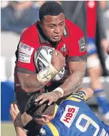  ??  ?? ■ Edinburgh’s Solomoni Rasolea crashes through Zebre scrum-half Marcello Violi yesterday.