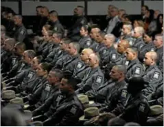  ?? TIM ROSKE/ AP PHOTO ?? Members of the newest class of New York state Troopers listen to remarks delivered at the New York State Police Basic School graduation ceremony.