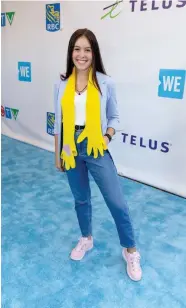  ?? VITO AMATI ?? Maddison with her HUG scarf on the WE Carpet at WE Day Toronto.