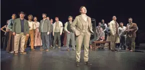  ?? MICHAEL BROSILOW ?? The Stage Manager (Laura Gordon, front) and the people of Grover's Corners look skyward in "Our Town." The Milwaukee Repertory Theater production concludes its run Sunday.