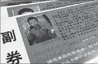  ?? WU MENG / FOR CHINA DAILY ?? The photo of Xie Yujie, who went missing on Oct 6, 2013 at the age of 6, is printed on the entrance ticket of a temple fair in Kaifeng, Henan province.