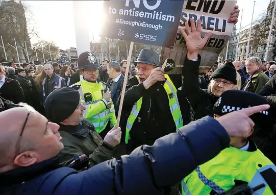  ??  ?? Passionate: Protesters loudly make their case – and argue with their opponents – in Parliament Square yesterday