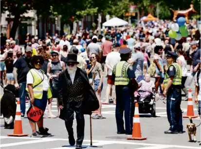  ?? PBOTOS BY JESSICA RINALDI/GLOBE STAFF/FILE ?? During the 2022 Boston Open Streets event in Jamaica Plain, people filled Centre Street (above).