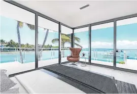  ?? DOUGLAS ELLIMAN REAL ESTATE/COURTESY PHOTOS ?? The 11,556-square-foot gated estate with 320 feet of waterfront is on sale for $25 million, making it the most expensive listed home on Key Biscayne.