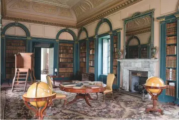  ??  ?? Above: The library at Wimpole, home of one of the National Trust’s largest and earliest English carpets. Facing page: The saloon at Saltram with Robert Adam’s Axminster carpet