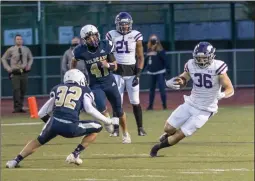  ?? Bobby Block/The Signal ?? (Above) Valencia running back Christian Alcantar (36) dodges a tackle attempt during the game against West Ranch on Friday night. (Below) West Ranch junior Dylan Cotti (8) scores a touchdown Friday. The Wildcats led early, but Valencia roared back to win the game 63-20.