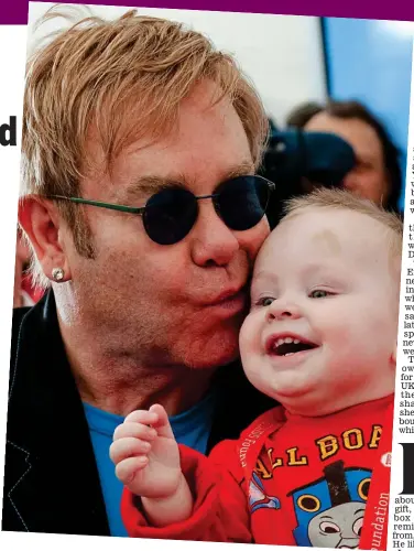  ?? Picture: REUTERS ?? Lev at first sight: Elton meets the toddler in 2009