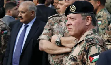  ?? (Reuters) ?? JORDAN’S KING Abdullah and his brother Prince Faisal attend the funeral of Captain Rashed Zyoud, who was killed during a raid conducted in Irbid by Jordanian security forces on Islamic State fighters, in Zarqa, Jordan in March.