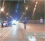  ?? AP ?? This scene from dashcam video taken Oct. 20, 2014 shows Laquan McDonald walking down the street moments before being shot by officer Jason Van Dyke in Chicago.