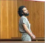  ?? ISHANI DESAI THE CALIFORNIA­N, FILE ?? Sebastian Parra, 23, glances at cameras Dec. 29 during his arraignmen­t in a Kern County Superior Court courtroom. Parra was indicted in the death of correction­s counselor Benny Alcala Jr., 43.