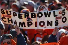  ??  ?? AP PHOTOS
A Broncos fan
holds up sign
during the rally.