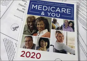  ?? WAYNE PARTLOW ?? FILE - In this Feb. 13, 2020, file photo, The Official U.S. Government Medicare Handbook for 2020 over pages of a Department of Health and Human Services, Office of the Inspector General report, are shown in Washington. At greater risk from COVID-19, some