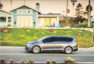  ??  ?? The 2019 Chrysler Pacifica Hybrid, built in Windsor, Ont., allows drivers to go approximat­ely 50 kilometres in emissions-free electric mode and will seamlessly switch to gas/electric-propulsion mode when needed.