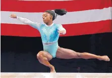  ?? ELISE AMENDOLA/ASSOCIATED PRESS ?? Simone Biles competes on the balance beam at the U.S. Gymnastics Championsh­ips on Sunday in Boston. Biles won the balance beam and captured her fifth U.S. title.