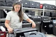  ?? Jeremy stewart ?? Polk County Elections Director Brande Coggins performs Logic and accuracy testing on one of the ballot scanners that will be used in the Nov. 2 elections.