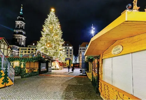  ?? FOTO: IMAGO IMAGES/ARVID MÜLLER ?? Rolladen runter: Der berühmte Dresdner Striezelma­rkt ist längst geschlosse­n.