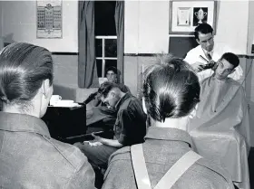  ?? GETTY IMAGES ?? The all-important haircut, one of the first rituals that every new conscript had to undergo