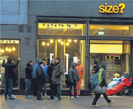  ??  ?? SHOE collectors from around Dundee queued in freezing temperatur­es to get the latest Nike design.
The Air VaporMax named The Ten went on sale today at 8am.
The trainers were going for a cool £210, but that didn’t put off nearly 20 hardy footwear fans...