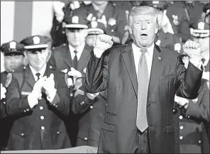  ?? AP/EVAN VUCCI ?? President Donald Trump, speaking to law enforcemen­t officials Friday in Brentwood, N.Y., said that in apprehendi­ng street-gang suspects, care needn’t be taken to protect them from harm.