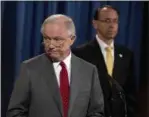  ?? AP — ANDREW HARNIK ?? Deputy Attorney General Rod Rosenstein watches at right as Attorney General Jeff Sessions steps away from the podium during a news conference at the Justice Department in Washington, Friday on leaks of classified material threatenin­g national security.