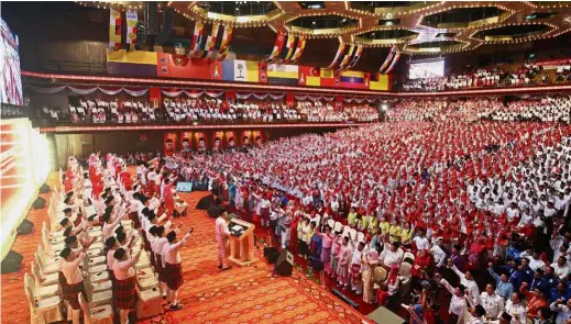  ??  ?? United front: Umno delegates cheering as Dr Ahmad Zahid launches the meetings of the Youth, Wanita and Puteri wings in conjunctio­n with the Umno General Assembly 2017 at the Putra World Trade Centre, Kuala Lumpur. — FAIHAN GHANI / The Star