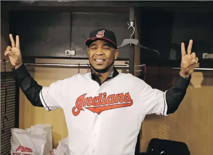  ?? TONY DEJAK/THE ASSOCIATED PRESS ?? Indians slugger Edwin Encarnacio­n smiles after being introduced to the local media in Cleveland on Thursday.