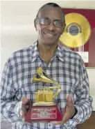  ?? ?? Engineer Errol Brown with his Latin Grammy Award for his work on Cultura Profetica’s album Sobrevolan­do