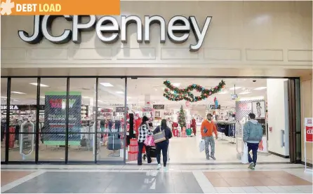  ?? — Reuters ?? Shoppers enter and leave the JC Penney department store in North Riverside, US.