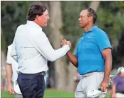  ?? AP - Lynne Sladky, file ?? Phil Mickelson (left) and Tiger Woods are set to match up again, this time teaming with superstar quarterbac­ks Peyton Manning and Tom Brady.